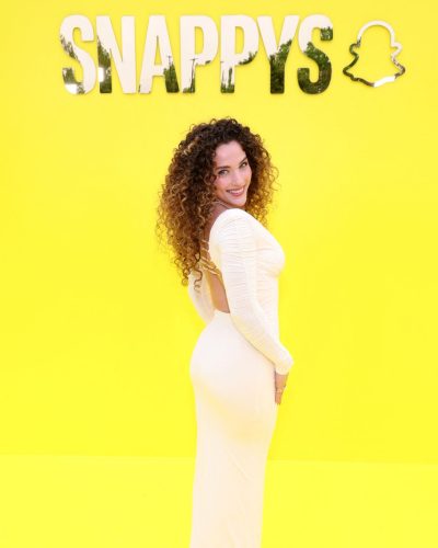 Sofie Dossi vibrant yellow dress featuring elegant long sleeves.