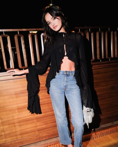 Sophia Hammons stylish black top and light blue denim jeans