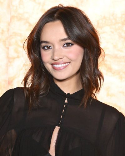 Sophia Hammons chic black top with flowing sleeves and blue jeans