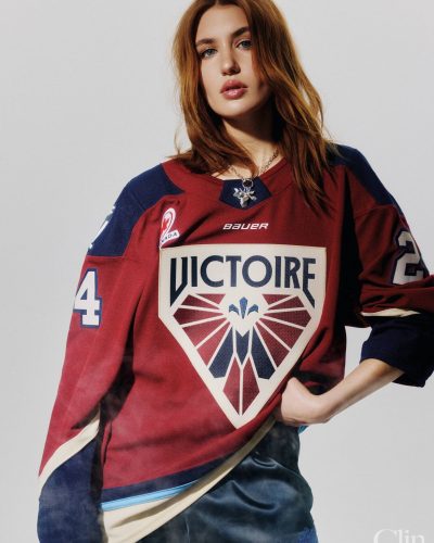 Sophie Nelisse featuring playful red hockey jersey and chic lace shorts.