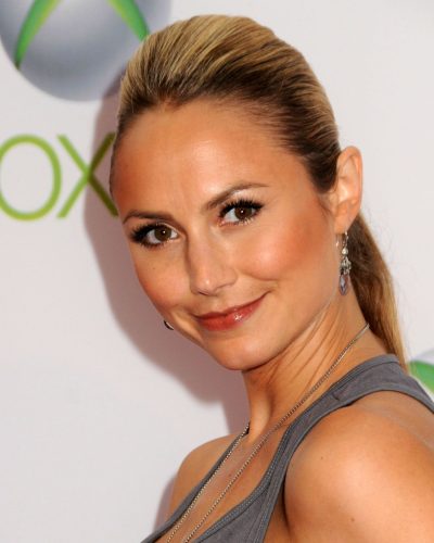 Stacy Keibler chic gray top and colorful teal skirt ensemble.