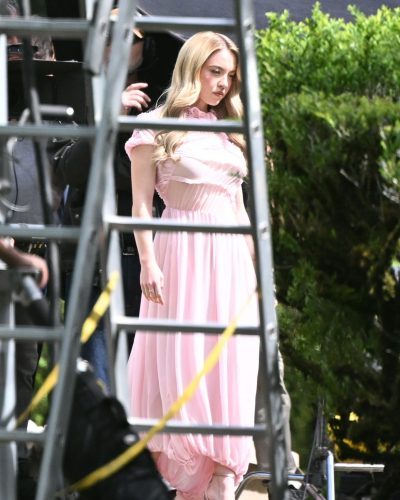 Sydney Sweeney pastel pink dress with delicate ruffles and greenery.