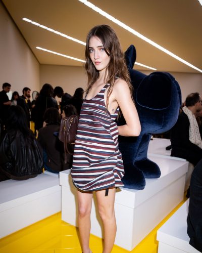 Talia Ryder in a colorful dress with a sleeveless and relaxed design.