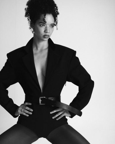 Tanzyn Crawford in artistic dress with a low neckline design