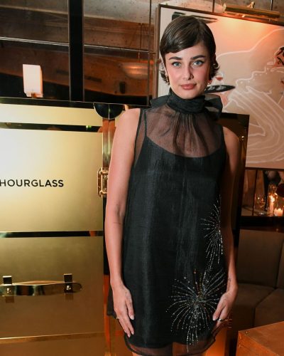 Taylor Hill black gown complemented by polished short hairstyle