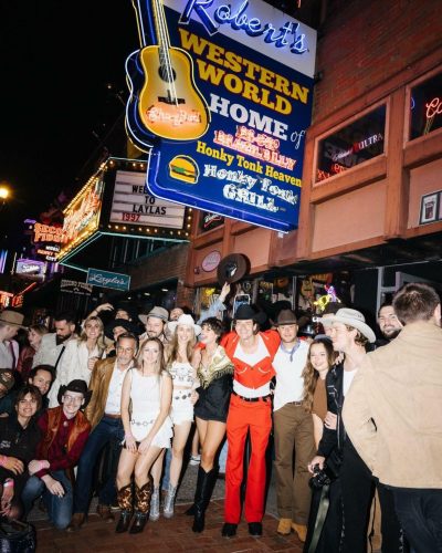 Taylor Hill black dress with long sleeves and short hemline