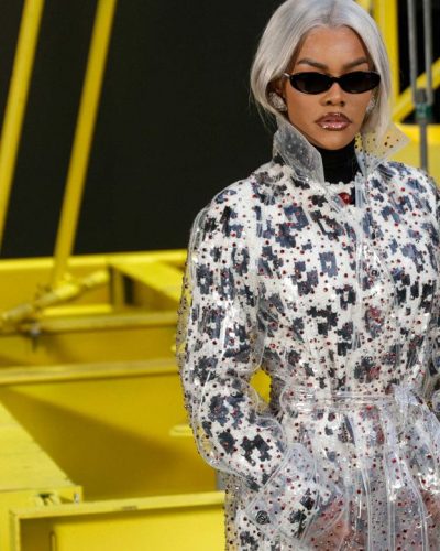 Teyana Taylor geometric print coat with black turtleneck and heels