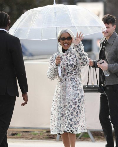 Teyana Taylor black turtleneck and clear coat with pointed heels