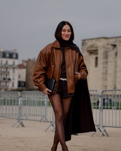 Tiffany Hsu in chic black clutch and pointed heels