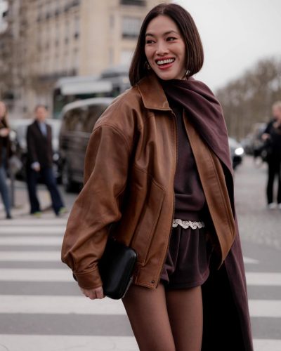 Tiffany Hsu styled with gold hoop earrings and cropped hair