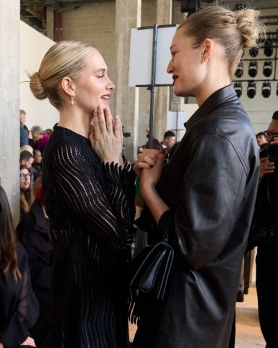 Toni Garrn wearing black leather coat with minimalistic black attire.
