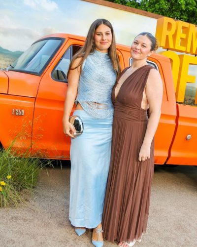 Tori Sulley wearing a flowy brown gown that resonates with warmth.