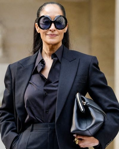 Tracee Ellis Ross accessorized with chic black handbag