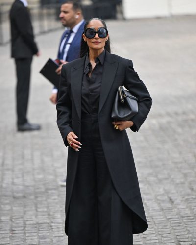 Tracee Ellis Ross wearing wide-leg black trousers