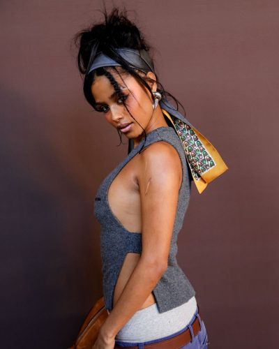 Tyla grey sleeveless top and navy trousers for fashion week