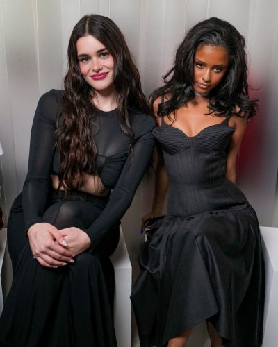 Tyla flowing black dress with structured bodice and playful elements