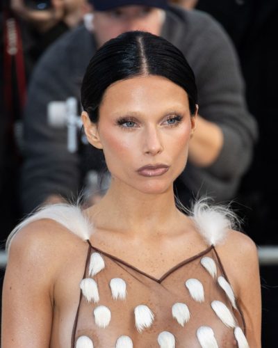 Valentina Zenere light fabric gown with sophisticated design elements.