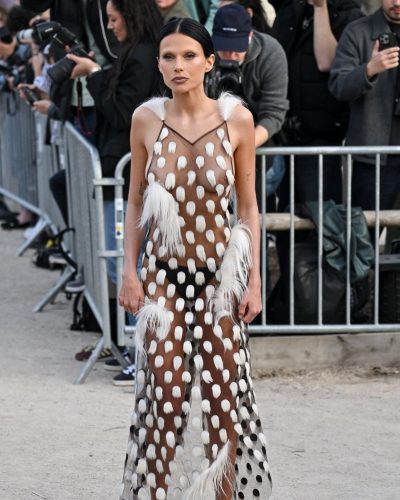 Valentina Zenere contemporary sheer gown emphasizing figure.