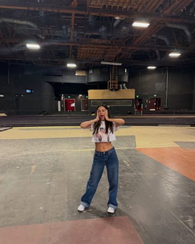 Victoria Justice with a fun graphic top and relaxed fit jeans.