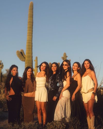 Victoria Justice in black lace dress against a natural backdrop