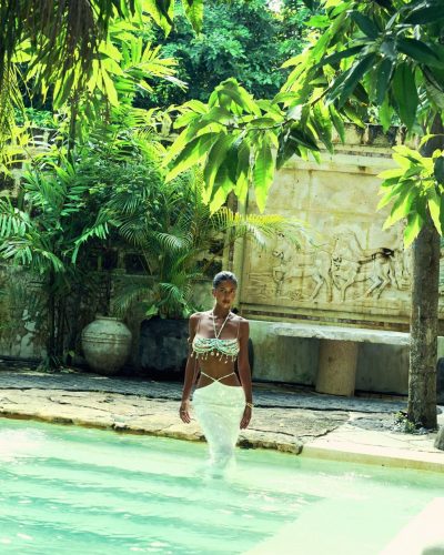 Viktoriia Pandei in white skirt paired with aqua beaded top