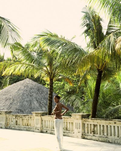 Viktoriia Pandei in beaded aqua top and layered jewelry