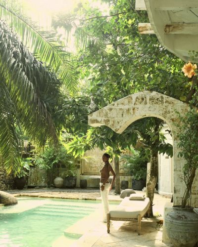 Viktoriia Pandei wearing white diaphanous skirt and beaded top