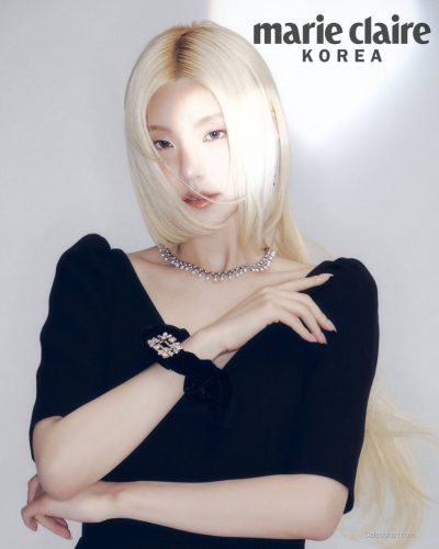 Yeji in form-fitting black dress with embellished scrunchie