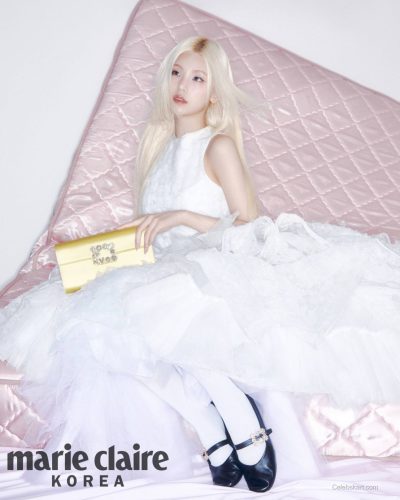 Yeji wearing chic black gown with embellished hair scrunchie