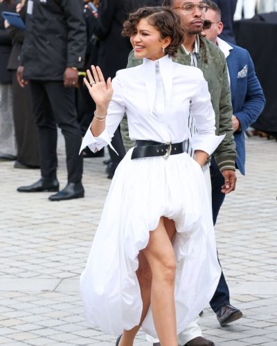 Zendaya Coleman in structured shirt paired with airy skirt.
