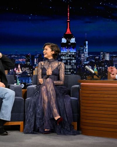 Zendaya in a fitted navy gown featuring delicate lace