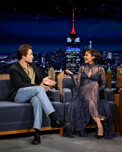 Zendaya in a navy lace gown accentuating her silhouette