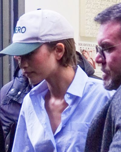 Zendaya dressed in a blue top and casual black shoes.