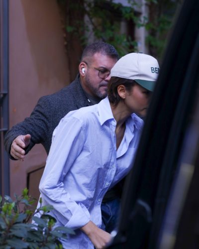 Zendaya in a casual blue shirt and denim for shopping.