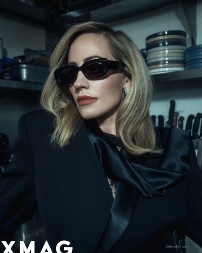 Zibby Allen in tailored black blazer and lace stockings.