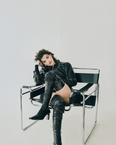 Zoe Steiner in stylish black leather mini dress