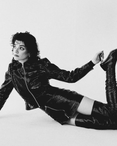 Zoe Steiner in textured black leather mini skirt