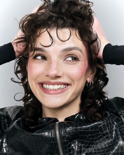 Zoe Steiner wearing thigh-high black leather boots